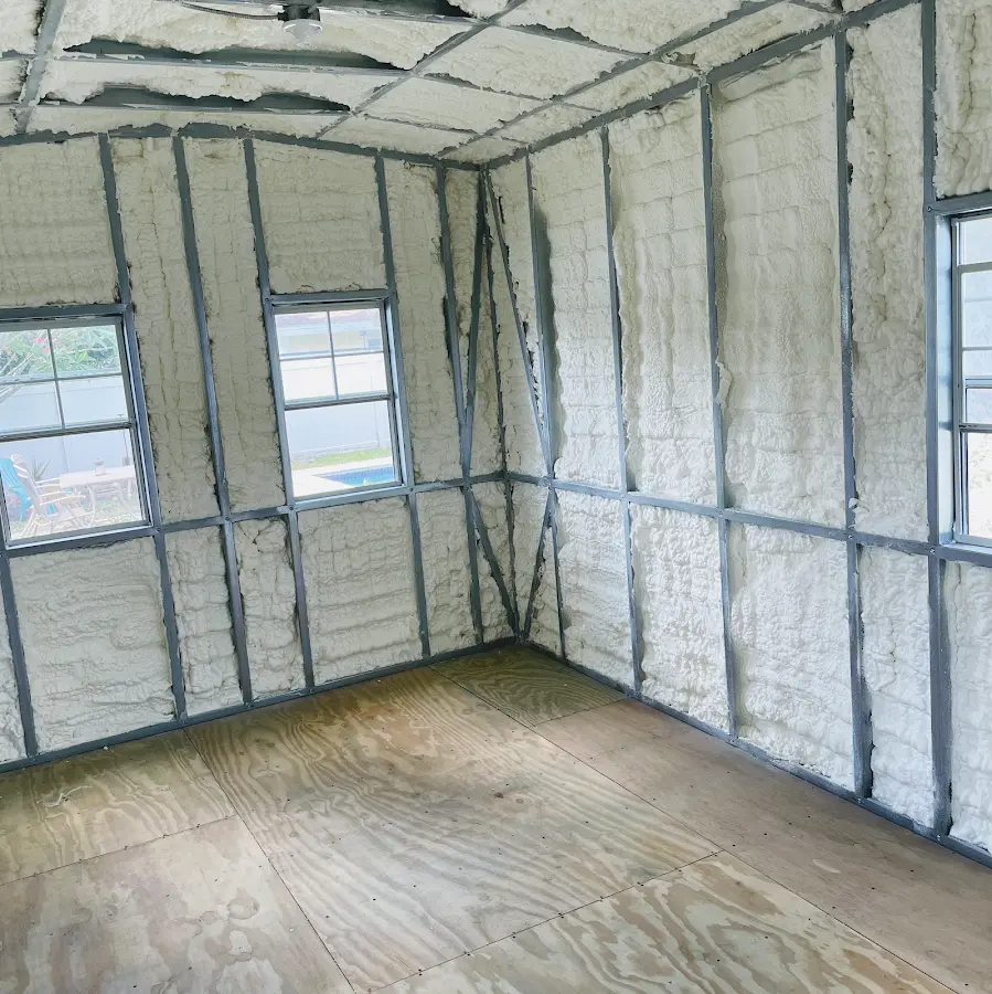 Closed-cell spray foam insulation applied to wall cavities in a residential project in Dakota Dunes